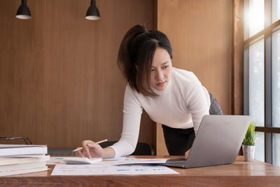 Businesswoman working at table