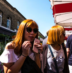 Portrait of young woman in sunglasses