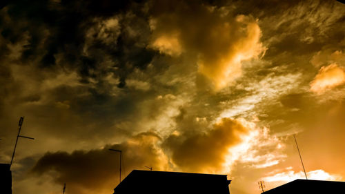 Low angle view of cloudy sky at sunset