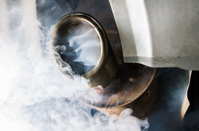 Close-up smoke emitting from car