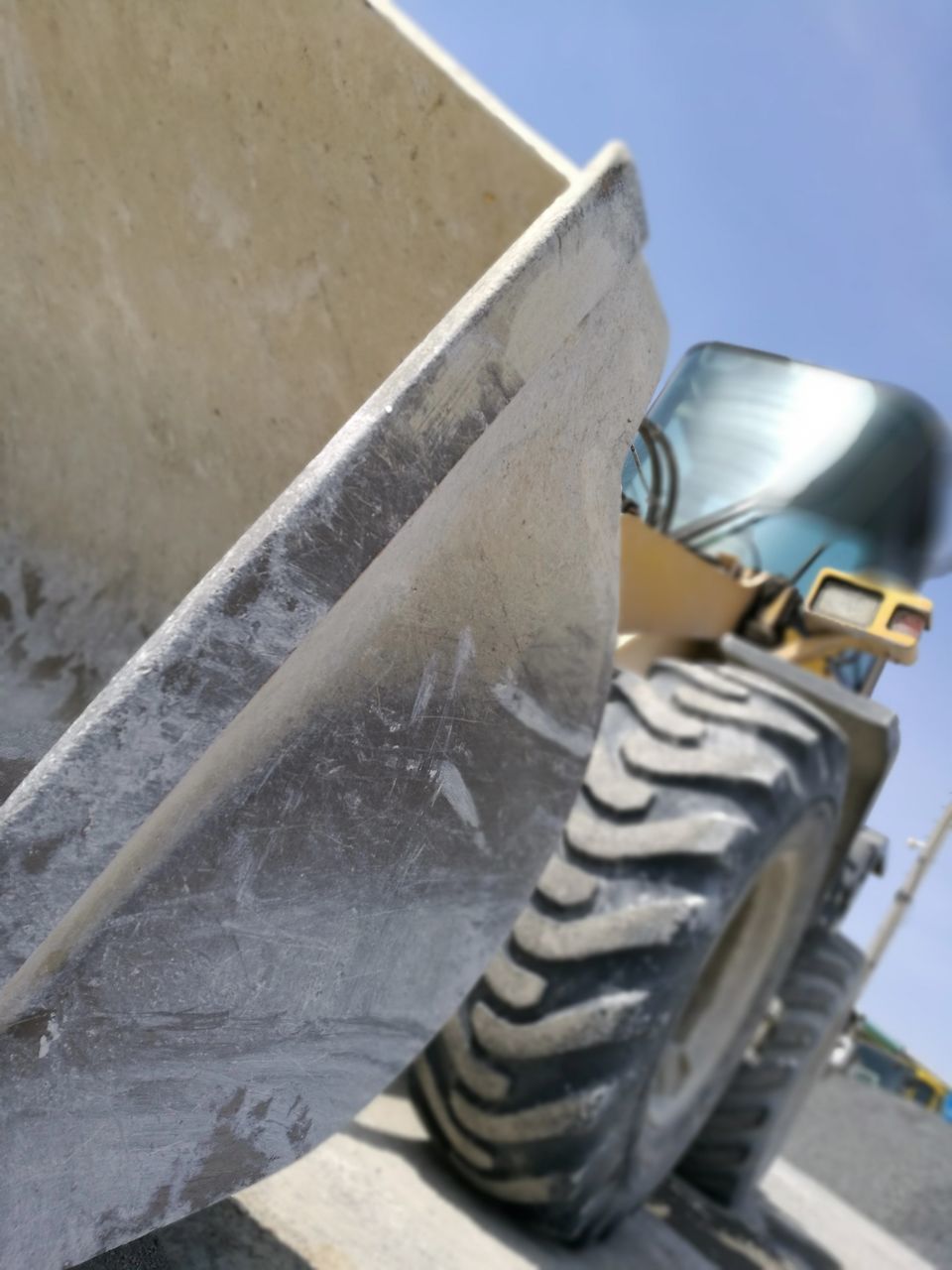 CLOSE-UP OF VINTAGE CAR ON ROAD