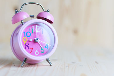 Close-up of clock on table