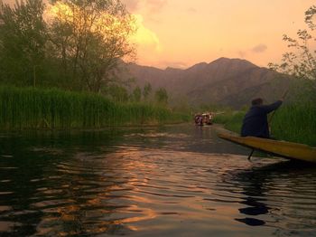 Scenic view of lake against sky during sunset