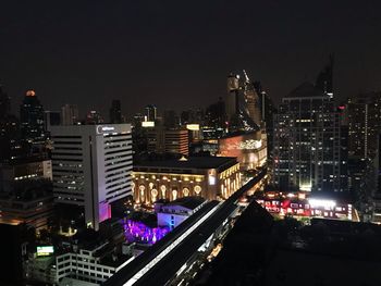 High angle view of city lit up at night