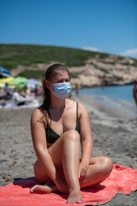 Woman sitting on beach