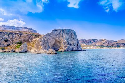 Scenic view of sea against cloudy sky