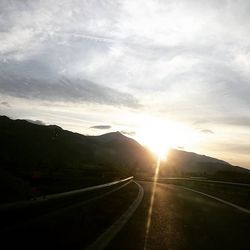 Scenic view of road against sky during sunset