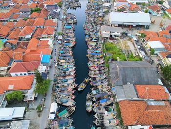 Beautiful aerial view of boats lined up in a fishing village, in west java - indonesia.