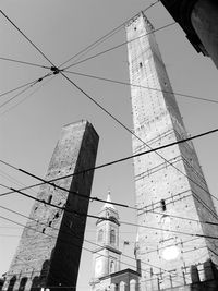 Low angle view of electricity pylon against sky