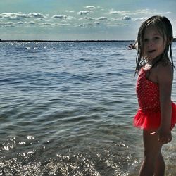 Girl standing on shore