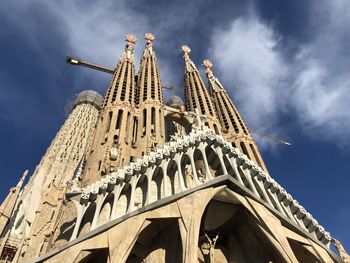 Low angle view of la sagrada familia against sky