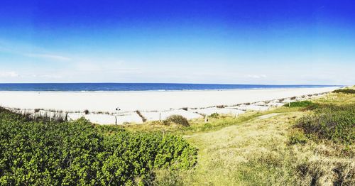 Scenic view of sea against clear blue sky