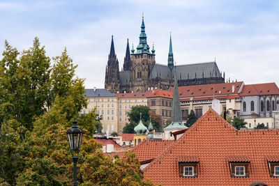 Buildings in city against sky