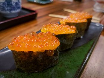 Close-up of sushi served on table