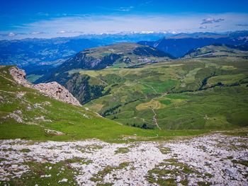 Scenic view of landscape and mountains against sky