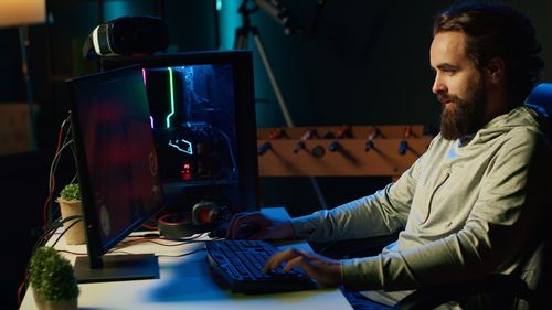 Young man using laptop at home