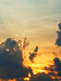 Low angle view of dramatic sky during sunset