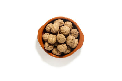 High angle view of bread in bowl against white background
