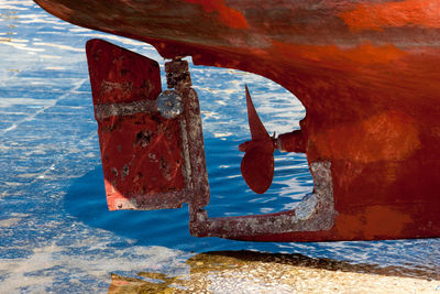 Close-up of rusty metallic boat in sea