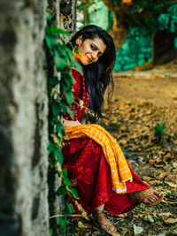 Portrait of woman sitting at park