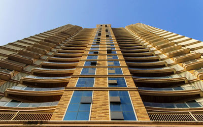 Low angle view of modern building against clear sky