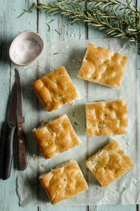 Top view of italian focaccia on wooden table.