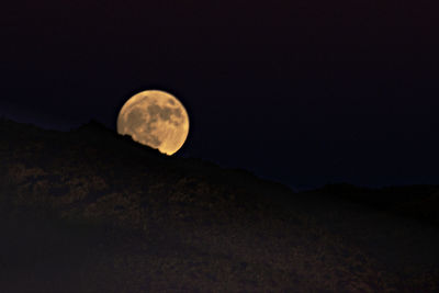 Scenic view of moon against sky at night