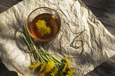 High angle view of yellow flowering plant on table