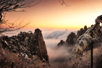 Scenic view of mountains against sky during sunset