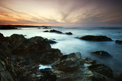 Scenic view of sea at sunset