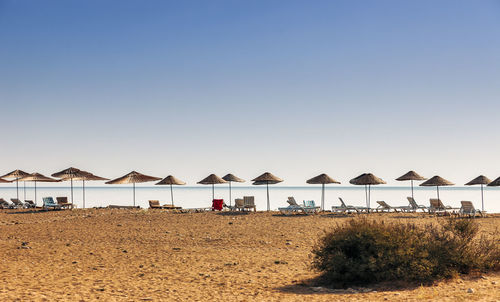 Scenic view of beach against clear sky