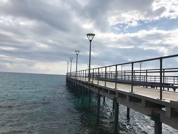 Pier on sea against sky