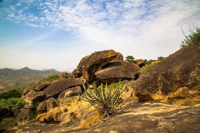 Rock formation on mountain against sky