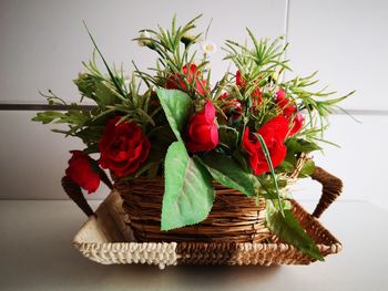 Close-up of red roses on table