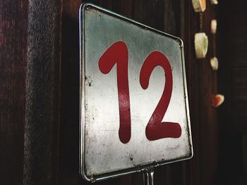 Close-up of numbers on metal placard