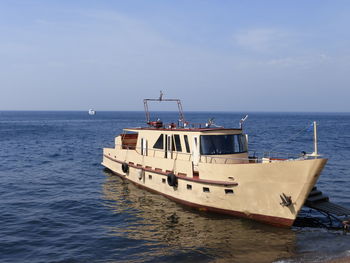 Ship in sea against sky