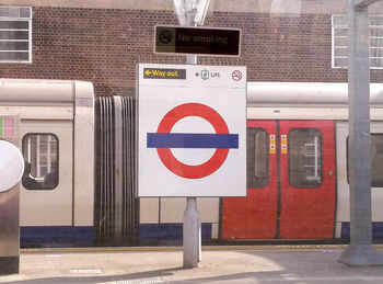 Information sign on railroad station in city