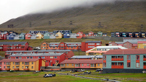 Buildings in town against sky