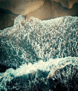 High angle view of water splashing in sea