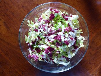 High angle view of chopped vegetables in bowl on table