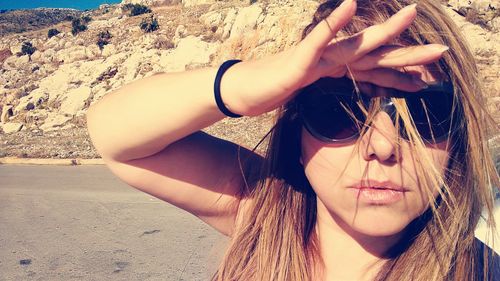 Portrait of young woman wearing sunglasses