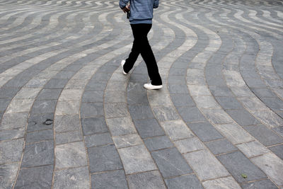 Low section of man standing on floor