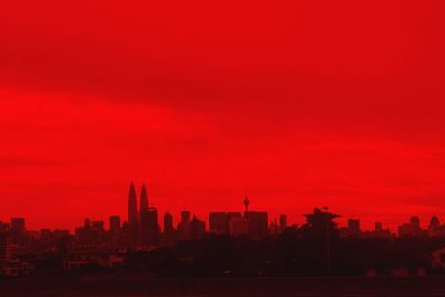 Silhouette of city at sunset