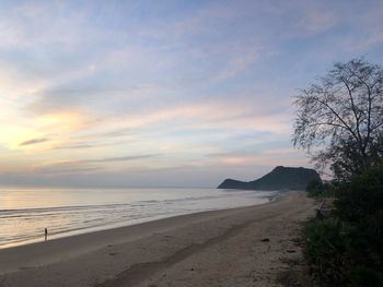 Scenic view of beach against sky during sunset