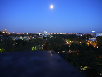 High angle view of illuminated buildings in city at night