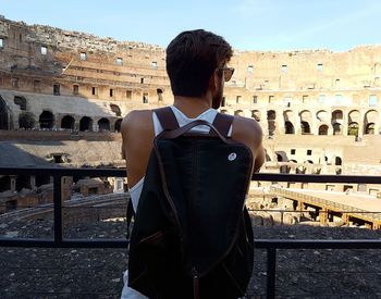 Full length of man standing at coliseum