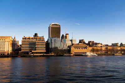 River and cityscape against sky