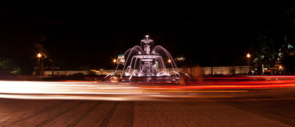 Blurred motion of car on road at night