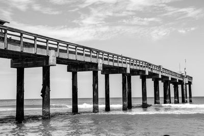 View of pier over sea against sky