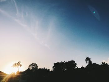 Low angle view of silhouette trees against sky during sunset